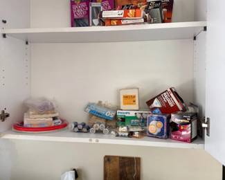 Laundry room cabinet with supplies and washer
