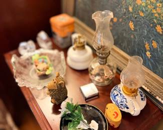 Dresser with glass perfume bottles and trinkets