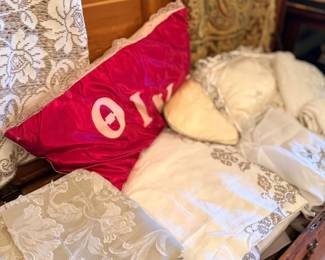 Decorative throw pillows including Greek-letter pillow