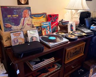 Media console with turntable and vinyl records