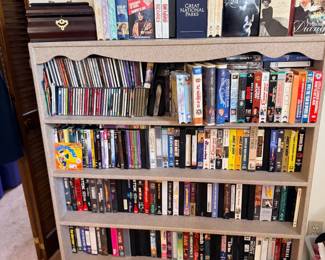 Bookshelf of books, VHS tapes and DVDs