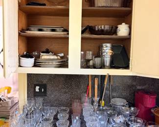 Kitchen cabinet cookware and assorted glassware
