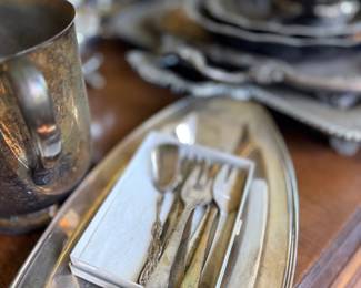 Silver serving tray with flatware and goblet