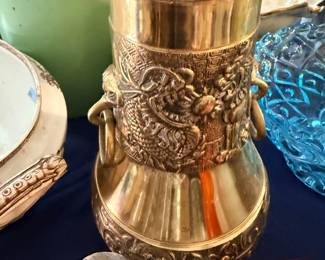 Ornate embossed brass vase