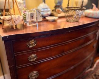 Mahogany bow-front chest of drawers with brass pulls