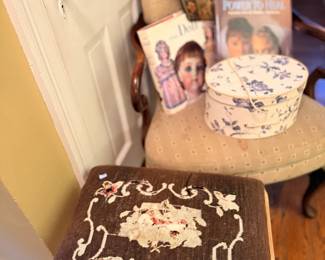 Needlepoint upholstered footstool with floral design