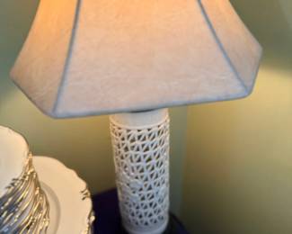Pierced white ceramic table lamp with linen shade