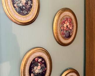 Set of oval gilt-framed floral prints
