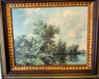 Framed landscape painting in ornate gold frame