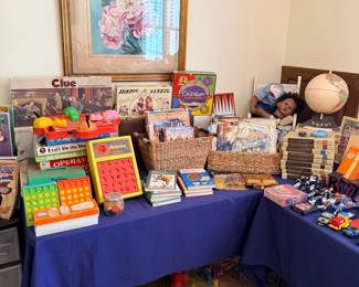 Room of games, toys, books and framed floral art