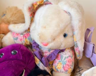 Plush bunny and Barney dinosaur toys