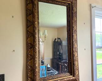 Ornate gold gilt-framed rectangular wall mirror