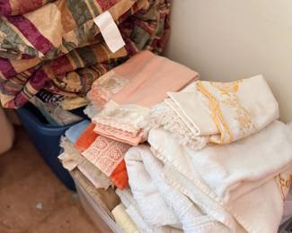 Bins of vintage linens, lace and doilies