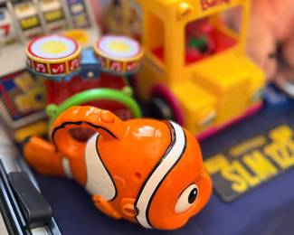 Children's toys including Finding Nemo and toy bus