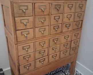 Vintage oak library card catalog with 40 drawers and distinctive brass pulls