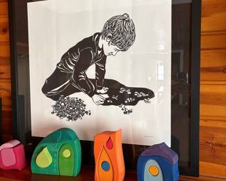 Child Doing a Puzzle Print by Nikki McClure