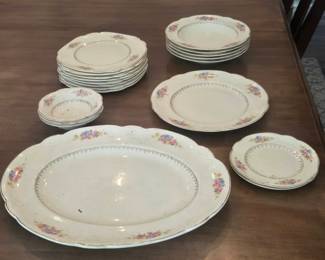 Homer Laughlin dinnerware items featuring a floral design with gold rim