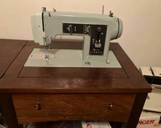 Sears sewing machine in cabinet