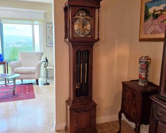 Gorgeous warm wood grandmother clock - good working condition, keeps accurate time, and chimes