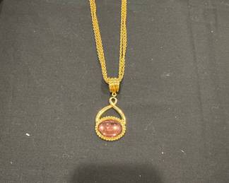 Gold Tone Oval Pendant Necklace with Faceted Pinkish-Purple Stone and Matching Earrings