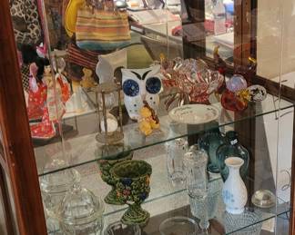 Display case with paperweight and glass art