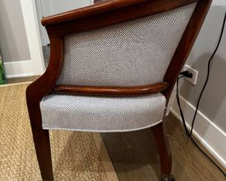 Regency-style barrel chair on casters