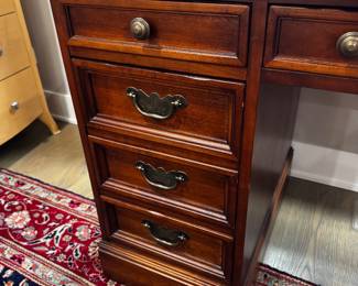Sligh leather top desk    30"h x 56"w x 26"d 