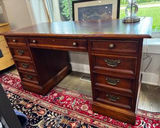 Sligh leather top desk    30"h x 56"w x 26"d 