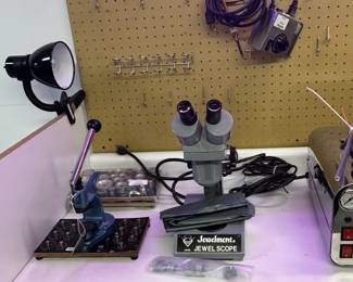 Jewelers tools including Jewelmont JS400 Jewel Scope and a "triebniet" used by watchmakers for repairing or replacing watch jewels and pressing parts.