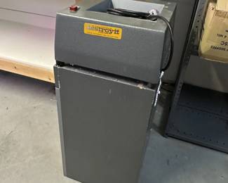 A vintage Destroyit paper shredder manufactured by the Electric Wastebasket Corp in New York