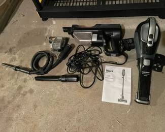 Two Handheld Vacuums Including Shark