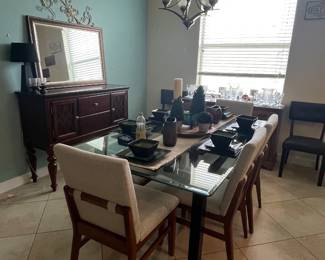 Beautiful dining table. Glass with 4 chairs and a bench