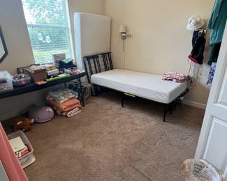 Twin bed mattresses with metal fold up frames.