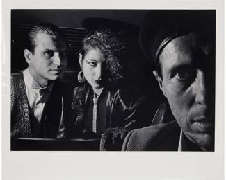 114 Ryan Weideman (b. 1941) "Self-Portrait with Vampire and Nymphet [sic]," from "In My Taxi: New York After Hours" series, 1987 Gelatin silver print on paper Edition: 4/10 Signed, titled, dated, and with numeric notations in pencil, all verso: Ryan Wiederman 1987 © / V3'5 / 5s6 / 30 / D-84 / B56291.1C Image: 12.625" H x 18.25" W; Sheet: 16" H x 20" W Estimate: $1,000 - $1,500