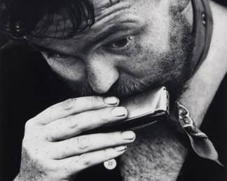 87 David Heath (1931-2016) "NYC" (harmonica player), plate 7 from "A Dialogue with Solitude," circa 1960 Gelatin silver print on paper From the edition of unknown size; printed in 1962 Signed in ink in the lower margin, at left: Dave Heath; titled, dated, and inscribed in pencil, verso "ADWS negative / master print 1962"; with other numeric pencil notations verso Image: 8.5" H x 6.5" W; Sheet: 10" H x 8" W Estimate: $6,000 - $8,000