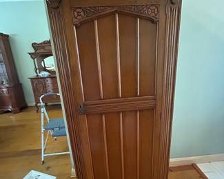 Unique antique coat closet with carved details