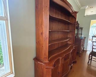 Elegant solid wood hutch with open shelving, cabinet storage, and curved detailing. Perfect for displaying dishes, collectibles, or décor while providing ample concealed storage below.