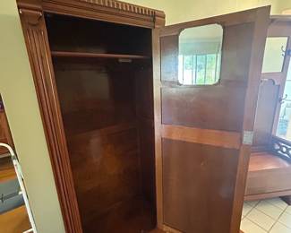 Unique antique coat closet with carved details