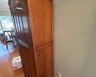 Unique antique coat closet with carved details