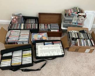 Large Music Media Collection Including CDs, Cassette Tapes and Storage Cases