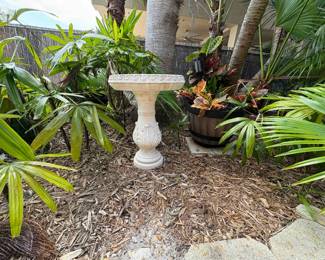 tropical jungle with dozens of clay pots, bird bath, fountain