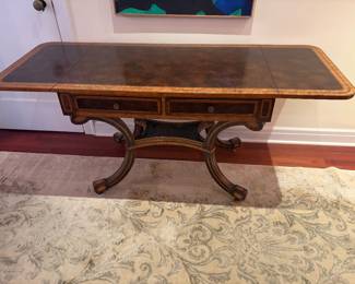 $680. Antique drop leaf library or entry table. As shown with leaves extended it is 64 inches wide by 24 inches deep by 29 inches high.