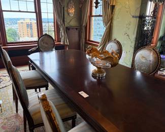 $9800. Custom dining set by EJ Victor. As seen in photo dining table measures 46 inches wide by 97 inches deep by 30 inches high.   Two 22" leaves available - one is installed currently.  Set includes eight side chairs and two arm chairs.