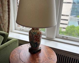 $280. Porcelain base lamp. 34 inches high to the top of the finial. Also, a view of the has found issues on the table surface.