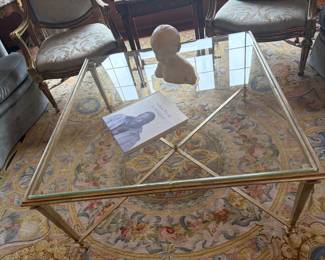 $420. Gilded metal cocktail table. 41 in.² by 21 inches high as found slight ding on the bottom left corner in the photo.