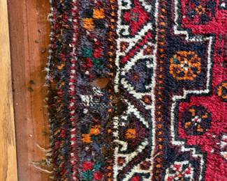 Close-up of the as found issue in the rug in previous photo