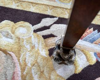 close up of brass frog feet.