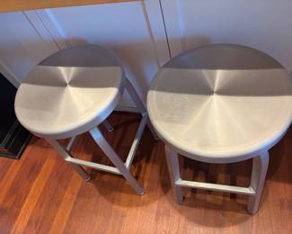$120. Pair of metal barstools 15 inch diameter by 24 inches high.  one has a slight dent.