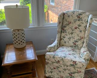 maple end table, pottery lamp, floral chair