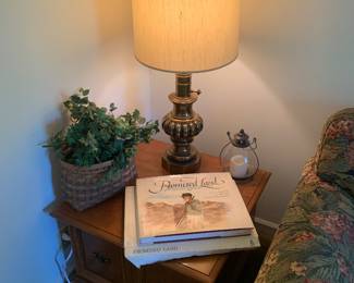 maple end tables, brass lamps 2 copies of Promised Land book